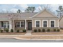 Charming home exterior with brick accents, neutral siding, and well-maintained landscaping at 8500 Union Central Ct, Waxhaw, NC 28173