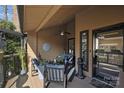 Inviting covered porch with comfortable seating, ceiling fan and stylish decor, perfect for relaxing at 9005 St Croix Ln, Charlotte, NC 28277