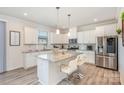 Bright kitchen with stainless steel appliances, granite countertops, and a center island at 1111 Fairbrae Ln, Indian Trail, NC 28079