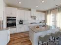Modern kitchen with stainless steel appliances, an island with barstool seating, and granite countertops at 134 Aberdeen Dr, Salisbury, NC 28144