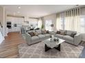 Open-concept living room featuring hardwood floors, a neutral palette, and an eat-in kitchen at 134 Aberdeen Dr, Salisbury, NC 28144