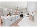 Bright, open kitchen featuring a large island with quartz countertops and stainless steel appliances, perfect for entertaining at 163 Stonewater Dr # 4P, Red Cross, NC 28129