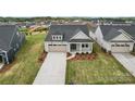 Aerial view of the home showcasing its location, landscaping, and proximity to other homes at 1726 Riverbend Ave # 177, Belmont, NC 28012