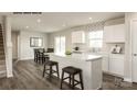 Modern kitchen with stainless steel appliances, a kitchen island, and an adjacent dining area at 256 Basildon St # 1045, Lancaster, SC 29720