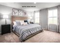 Comfortable bedroom with natural light, neutral walls, and stylish décor at 320 Basildon St # 1076, Lancaster, SC 29720