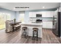 Well-lit kitchen with stainless steel appliances, center island, and dining area at 320 Basildon St # 1076, Lancaster, SC 29720