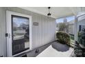 Inviting front porch with house number and view of the neighborhood at 6815 Cabot Cir, Charlotte, NC 28226