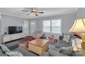 Inviting living room with hardwood floors, a ceiling fan, and lots of natural light at 708 S 10Th St, Bessemer City, NC 28016