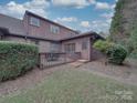 Backyard showing a wooden deck with outdoor seating and a lush, green lawn at 1124 Evergreen Cir, Rock Hill, SC 29732