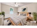 Cozy bedroom with a light wood bed frame, soft lighting and a neutral color palette at 14147 Maple Hollow Ln, Mint Hill, NC 28227