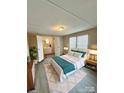 Bright bedroom features a large bed and an ensuite bathroom for added convenience at 1718 Fallston Rd, Shelby, NC 28150