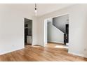 Open floor plan with hardwood floors leading into the kitchen and staircase at 1836 Danny Ct, Matthews, NC 28105