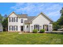 Charming two-story home with a well-manicured lawn and black shutters at 1836 Danny Ct, Matthews, NC 28105