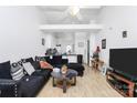 Bright living room boasts an open floor plan, vaulted ceilings, and sleek hardwood floors at 307 W Mcneely Ave, Mooresville, NC 28115