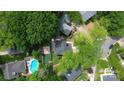 Aerial view of property featuring backyard pool, patio, and landscaped grounds at 3516 Mill Stream Ct, Charlotte, NC 28209
