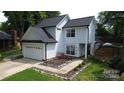 Charming two-story home features a well-maintained front yard and attached two-car garage at 3516 Mill Stream Ct, Charlotte, NC 28209