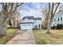Beautiful two-story home featuring a manicured lawn, a driveway, and a two-car garage with white exteriors at 3516 Mill Stream Ct, Charlotte, NC 28209