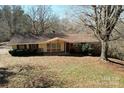 Inviting single-story home with vinyl and brick siding and a well-maintained front yard at 4730 16Th Street Ne Dr, Hickory, NC 28602
