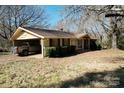 Cozy single-story home with a covered carport, neat landscaping, and a welcoming porch at 4730 16Th Street Ne Dr, Hickory, NC 28602