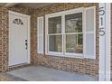 Inviting front entrance featuring a decorative glass door, window, and clear address numbers at 515 Richards Rd, Chester, SC 29706