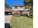 Charming two-story home with well-manicured lawn, brick accents, and an attached garage at 5516 Northwood Dr, Hickory, NC 28601