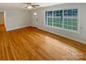 Bright living room with large window and hardwood floors at 5680 Hillsdale St, Fort Lawn, SC 29714