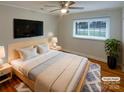 Tranquil bedroom featuring a ceiling fan, a window, and a TV at 5680 Hillsdale St, Fort Lawn, SC 29714