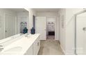 Modern bathroom with double vanity, tiled floor, and walk-in shower at 7925 Old Brook Rd, Sherrills Ford, NC 28673