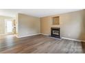 Bright living room features a fireplace, neutral walls and attractive floors at 830 Wilcrest Ct, York, SC 29745