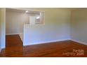 Spacious living room with polished wood floors and a bright, open atmosphere at 101 Colony Acres Dr, Charlotte, NC 28217