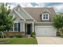 Charming two-story home with a well-manicured lawn, brick accents, and a two-car garage at 108 Hillston Ln, Mooresville, NC 28115