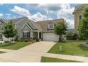 Attractive home boasting a manicured lawn, a two-car garage, and inviting curb appeal at 108 Hillston Ln, Mooresville, NC 28115