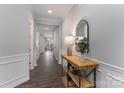 Elegant hallway features wood floors, crisp white trim, and a decorative console table at 108 Hillston Ln, Mooresville, NC 28115