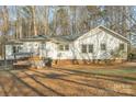 The backyard features a swing, a wooden patio, and well-maintained landscaping at 530 Wilmot Trl, Gastonia, NC 28056
