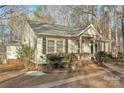 Exterior view of the home featuring a charming front porch and detailed landscaping at 530 Wilmot Trl, Gastonia, NC 28056