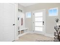 Bright entryway with a modern front door, custom drop zone, and stylish decor for an inviting first impression at 680 Candela Ct # 52, York, SC 29745