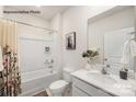 Bright bathroom with a shower-tub combination, stylish vanity, and decorative accents at 7921 Old Brook Rd, Sherrills Ford, NC 28673