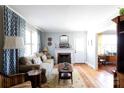 Bright living room with a decorative fireplace, hardwood floors, and stylish curtains at 968 Waverly Ave, Rock Hill, SC 29730