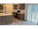 Open kitchen featuring stainless steel appliances and a large center island at 133 Plank Barn Ln, Stony Point, NC 28678