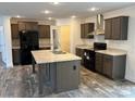 Modern kitchen features stainless steel appliances and a large center island at 133 Plank Barn Ln, Stony Point, NC 28678