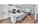 Modern kitchen features a large island, stainless steel appliances, and hardwood floors at 1943 Catkin Ln, Charlotte, NC 28205