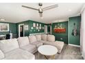 Stylish living area showcasing green walls, recessed lighting, and comfortable seating at 4000 Elizabeth St, Hickory, NC 28601