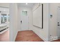 Bright entryway with wood floors, white walls, and modern art at 4785 Formation Ct # 101, Lancaster, SC 29720