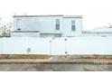 Home featuring a white fence for added privacy and curb appeal at 7005 Stonington Ln, Charlotte, NC 28227