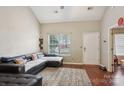 Bright living room with high ceilings, wood floors, and abundant natural light at 9160 Exbury Ct, Charlotte, NC 28269