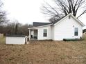 Exterior view of the back of the house, showcasing a storage shed and covered area at 107 Old Rocky Ford Ln # Pt1, Statesville, NC 28625