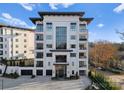 Elegant condo building features modern design, large windows, and private balconies with scenic street views at 19329 Watermark Dr # 551/552, Cornelius, NC 28031