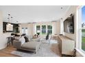 Bright and airy living room featuring a sectional sofa, large windows, and seamless flow to the dining area at 2241 Cobble Ct # 221, Monroe, NC 28110