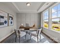 Bright office featuring panelled walls, a desk, seating and a large window at 281 Supernova Dr, York, SC 29745
