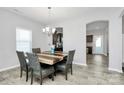 Dining area features a wood table, chandelier, and access to the kitchen for easy serving at 404 Brannon Meadows Dr # 270, York, SC 29745